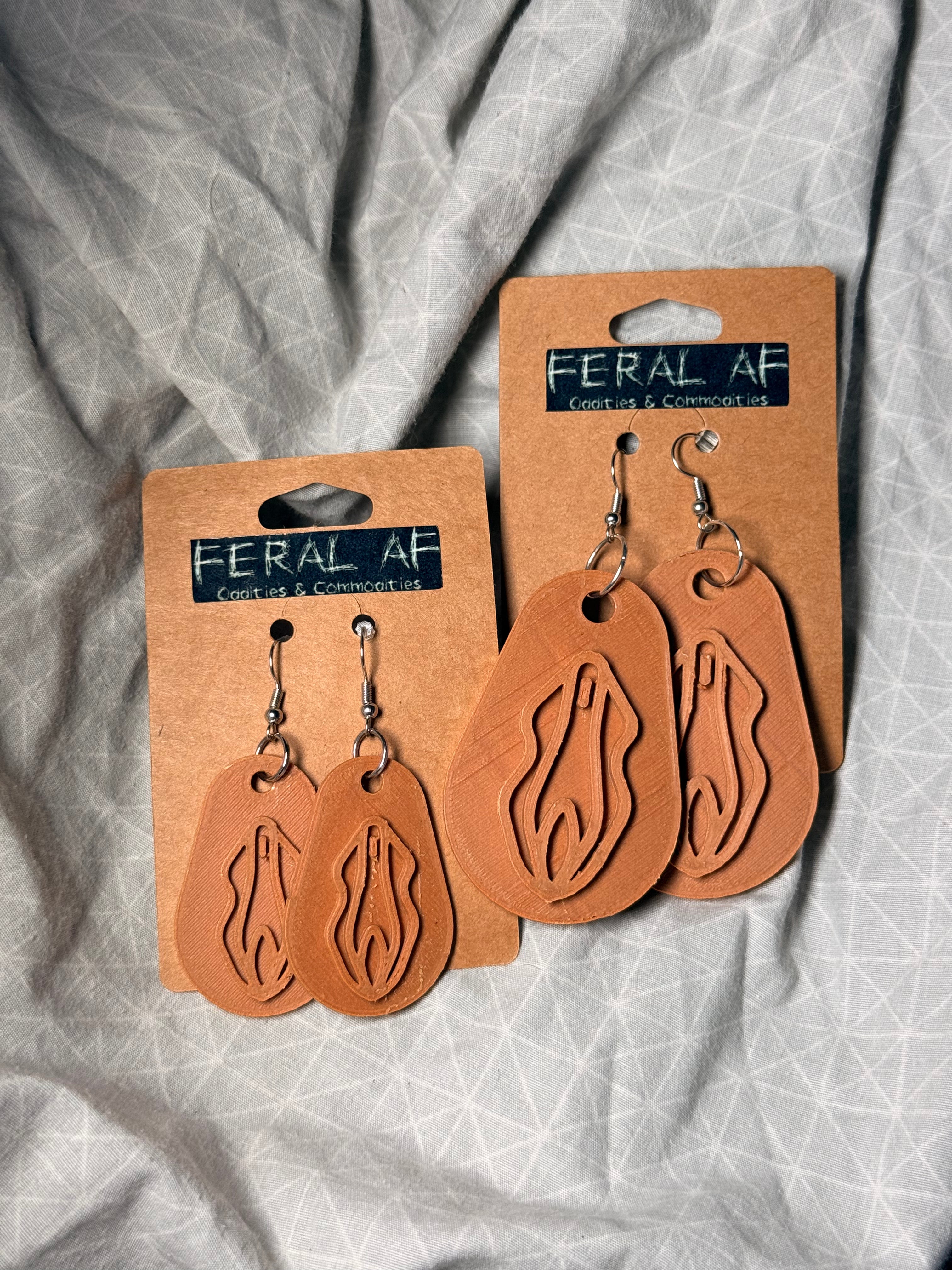 Lt brown vagina 3D earrings