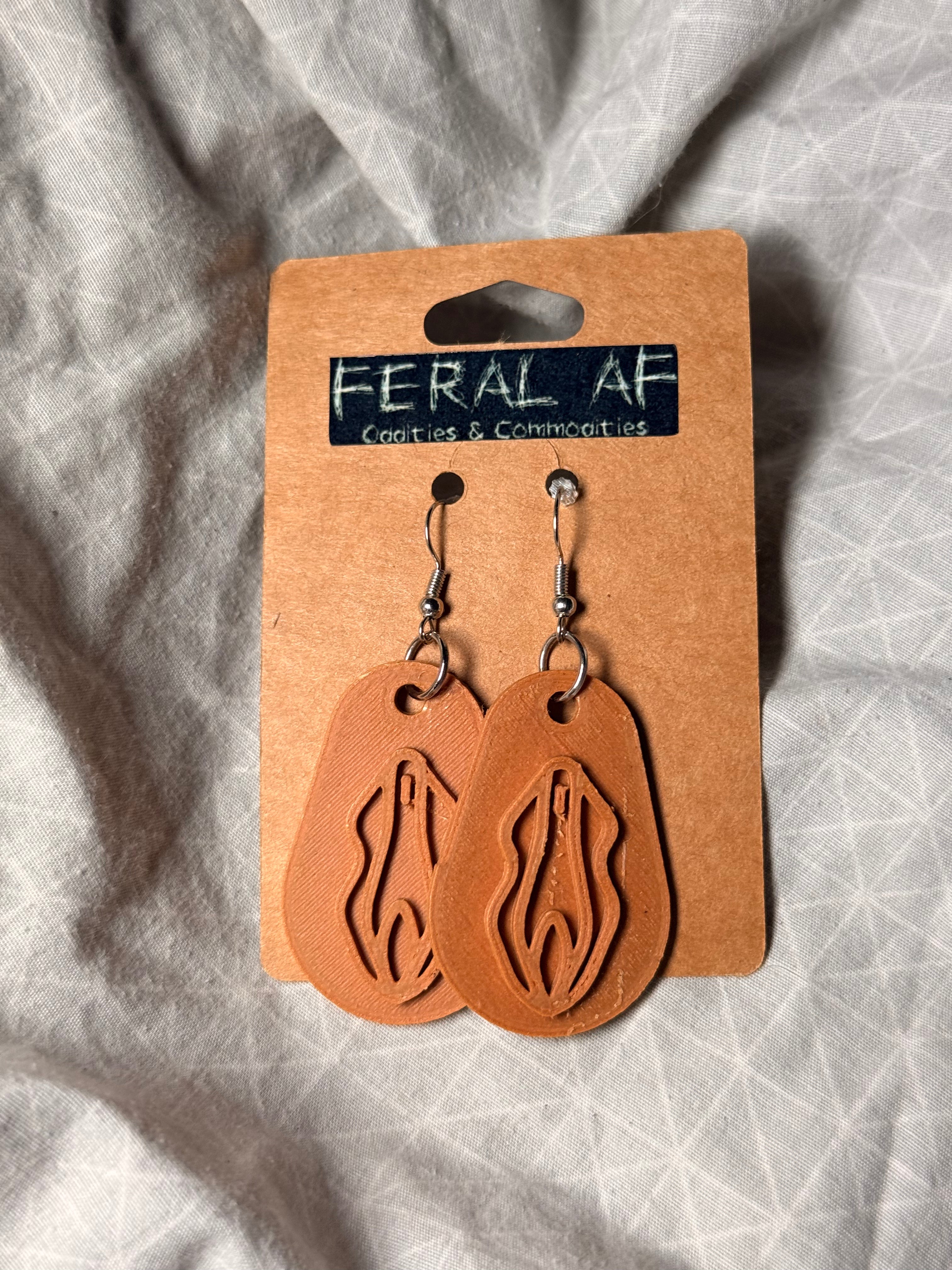 Lt brown vagina 3D earrings
