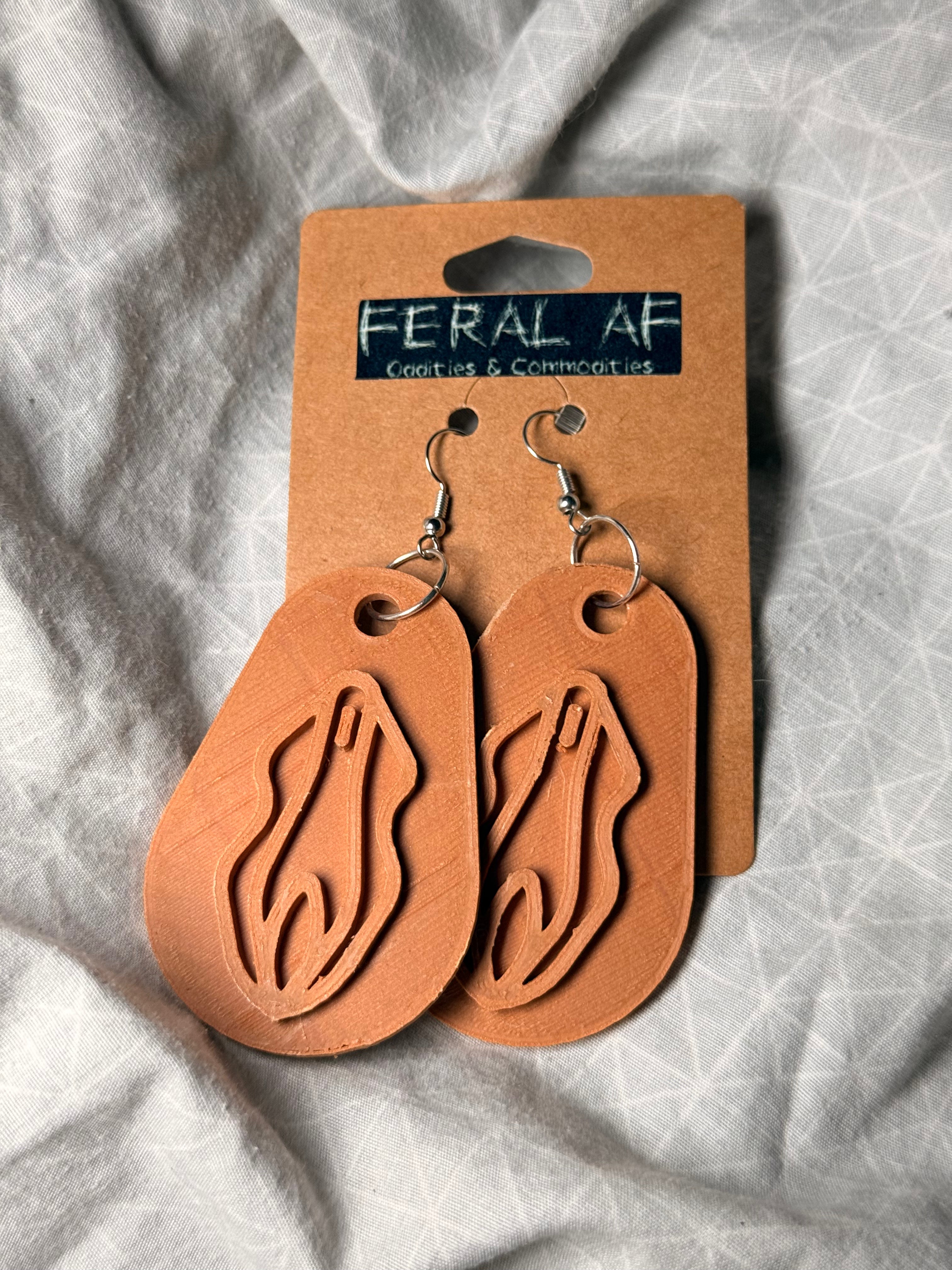 Lt brown vagina 3D earrings