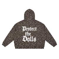 A cropped hoodie with a brown and black leopard print pattern, featuring the text 'Protect the Dolls' in a white Gothic font on the back.